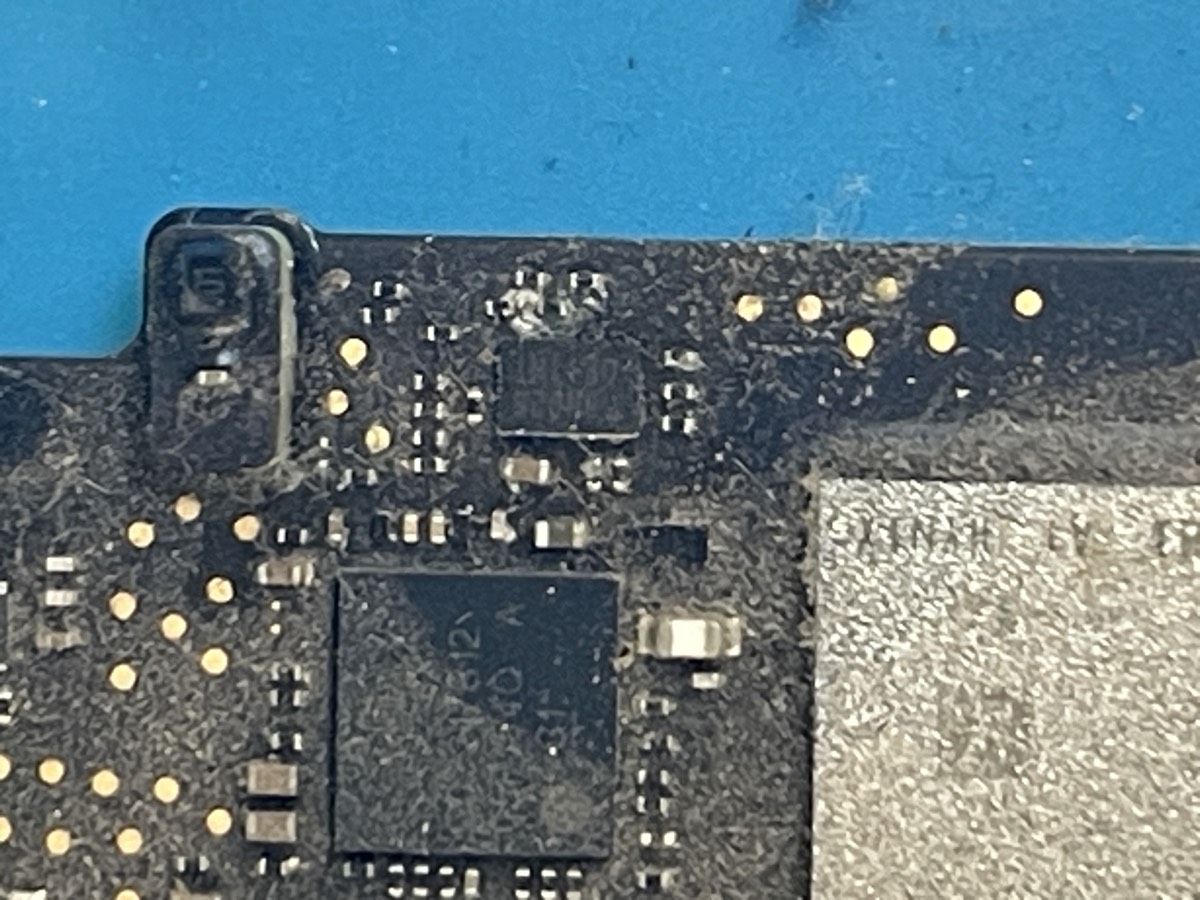 Liquid damage corrosion on MacBook logic board being repaired at The Mac Space