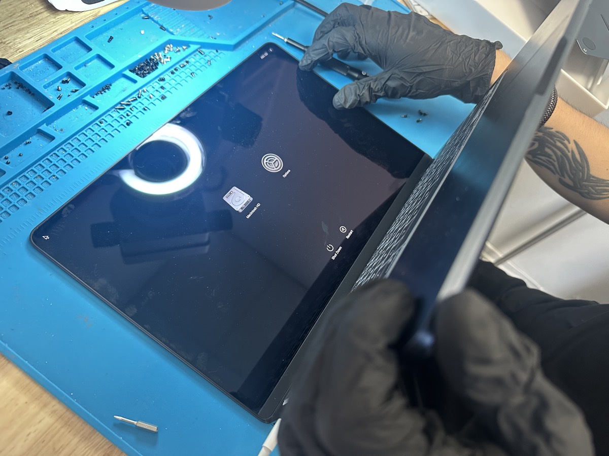 Mac technician repairing a MacBook at The Mac Space in Marietta GA