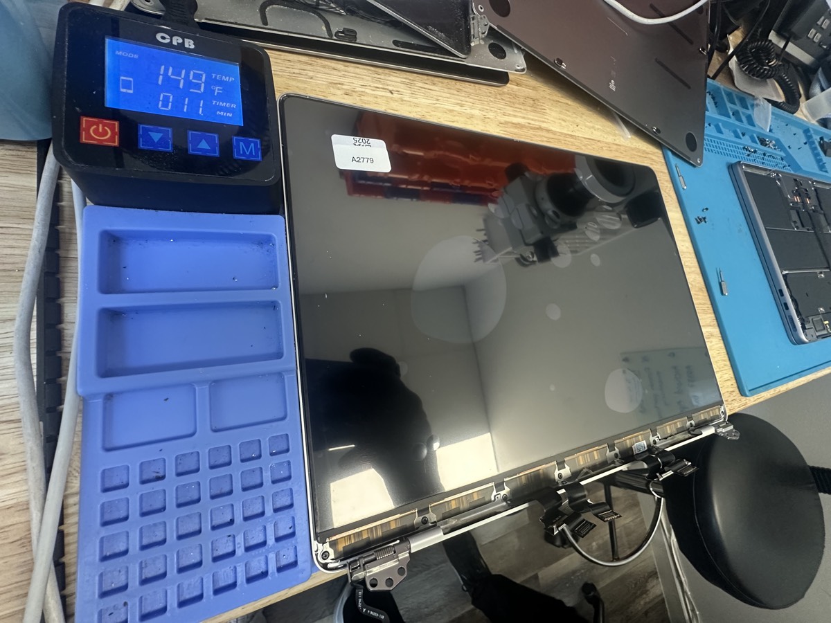 MacBook screen replacement in progress at The Mac Space repair bench in Marietta GA